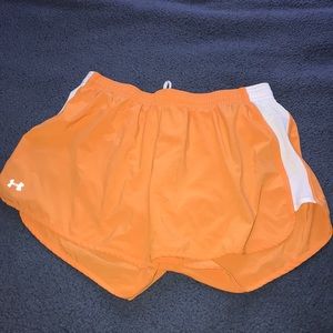 Orange UA athletic shorts